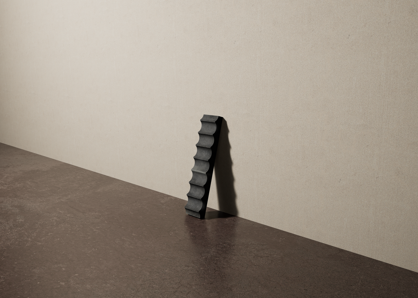 a 2"x10" bespoke fluted concrete tile with eight peaks leans against a textured, plaster wall on an unfinished concrete floor