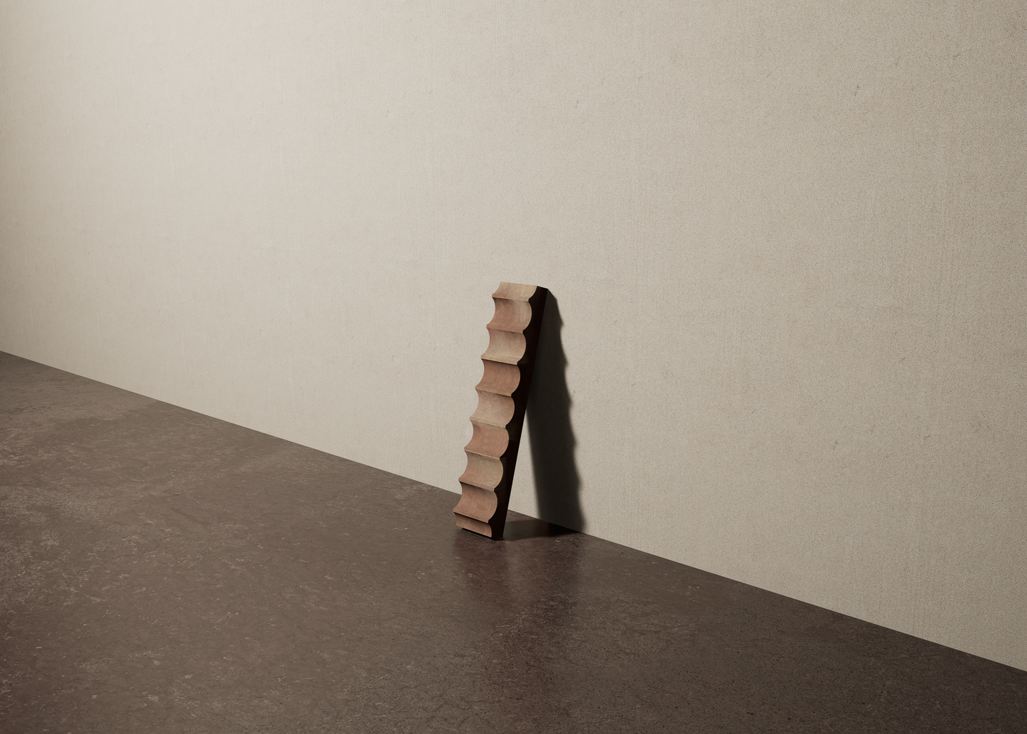 a 2"x10" bespoke fluted concrete tile with eight peaks leans against a textured, plaster wall on an unfinished concrete floor