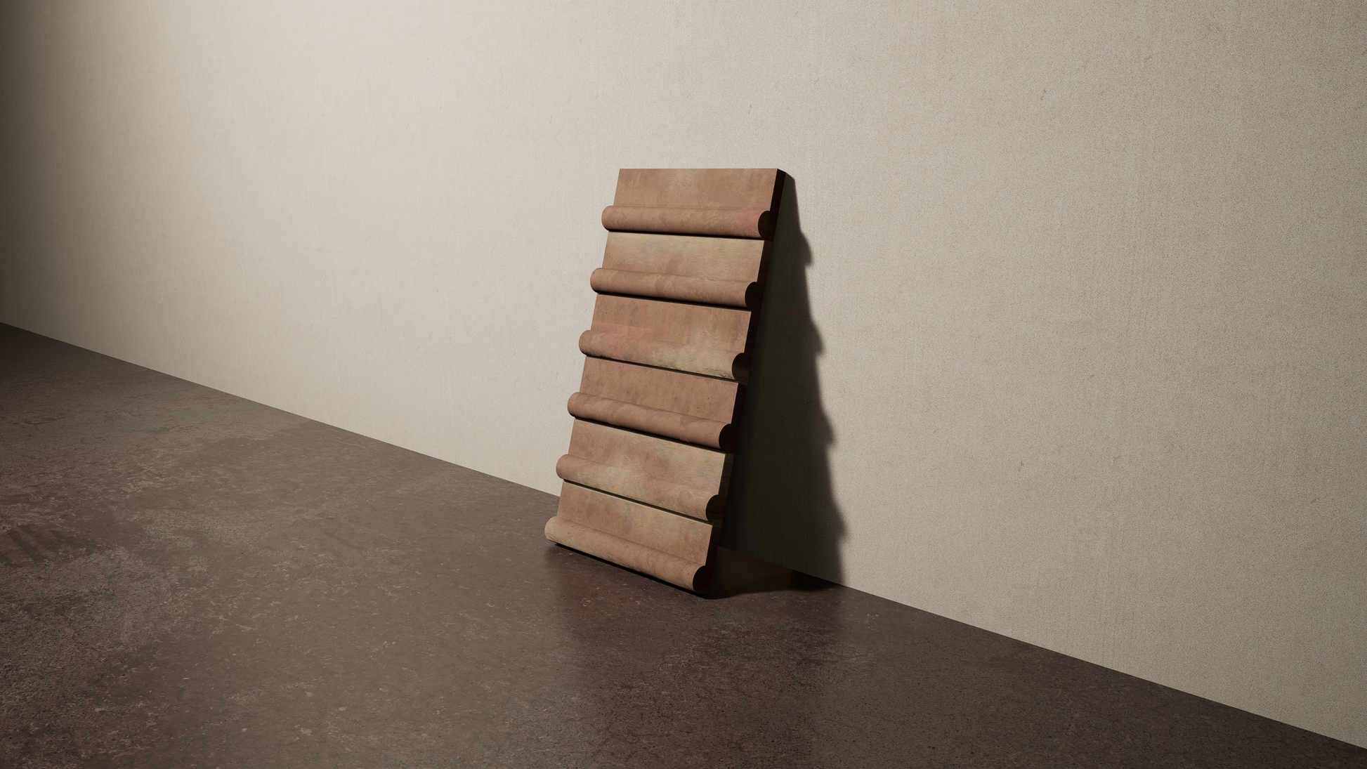 a 8"x15" bespoke concrete tile with six rounded ribs leans against a textured, plaster wall on an unfinished concrete floor